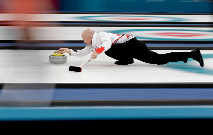 Canada’s skip Kevin Koe throws a stone during a men’s curling match against Japan at the 2018 Winter Olympics in Gangneung, South Korea, Feb. 20, 2018.