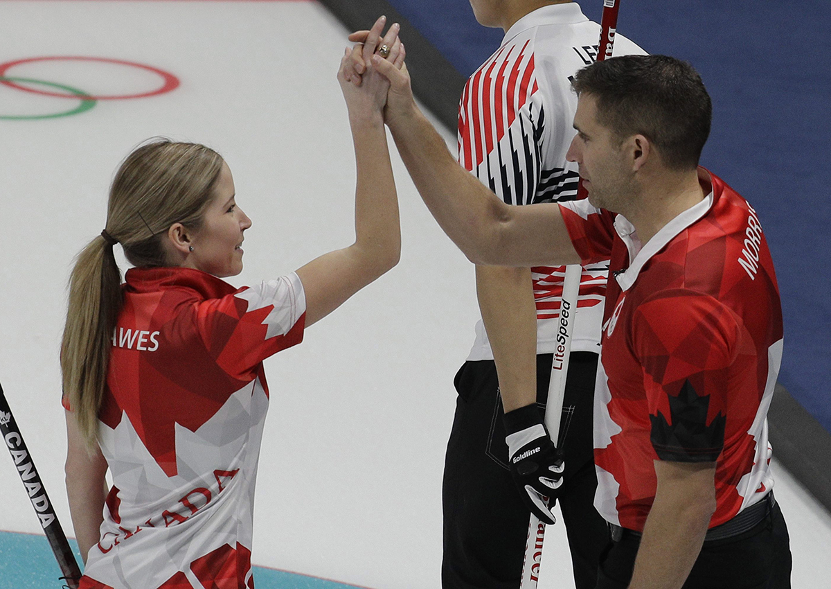 Canada’s Kaitlyn Lawes and John Morris reacts after winning their mixed doubles curling match against South Korea at the 2018 Winter Olympics in Gangneung, South Korea, Sunday, Feb. 11, 2018.