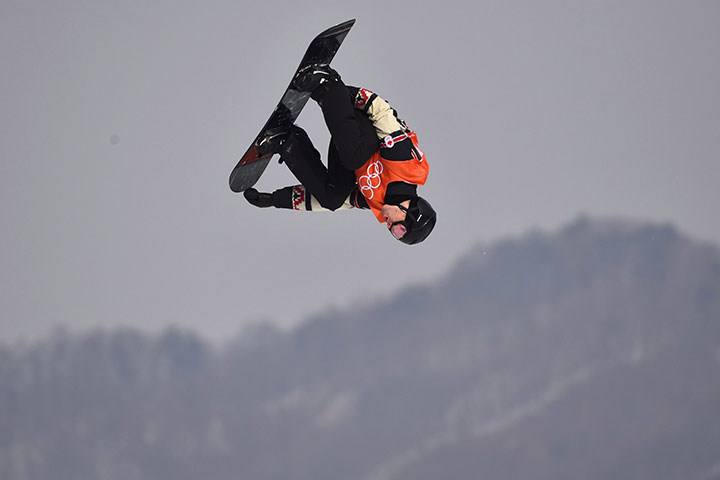 Canada's Max Parrot flies through the air during his second run in the men's snowboard slopestyle qualification at the Phoenix Snow Park at the 2018 Winter Olympic Games in Pyeongchang, South Korea, Feb. 10, 2018. 