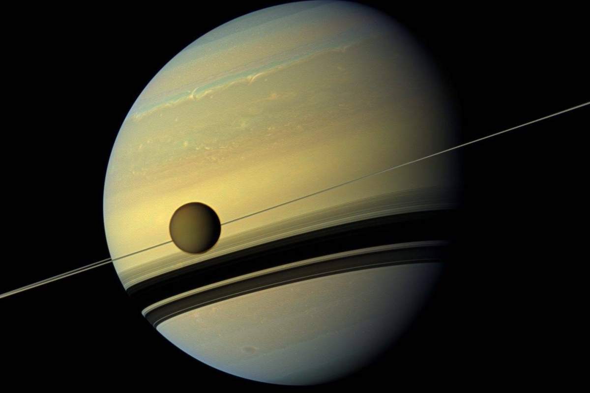 An image provided by NASA shows Saturn's largest moon Titan passing in front of the giant planet in an image made by NASA's Cassini spacecraft.
