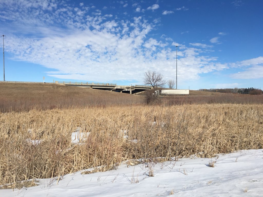 A truck drives under the Highway 1 overpass west of Portage la Prairie that will eventually be replaced.