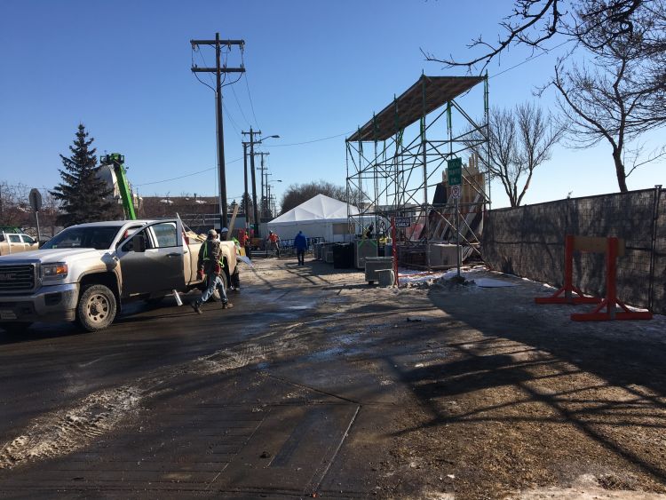 Workers dismantle the Red Bull Crashed Ice track Sunday morning following the championships.