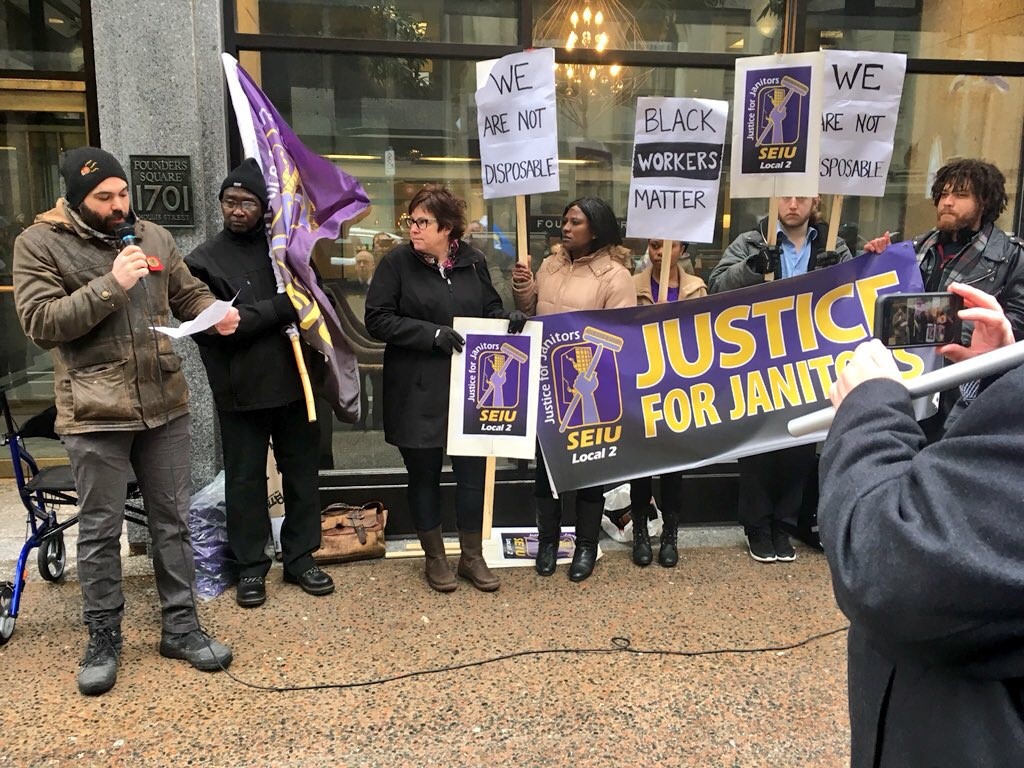 SEIU Local 2 members set to lose their cleaning jobs protested with their supporters in front of Founders Square Halifax on March 23, 2018.