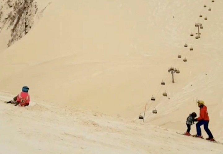 Orange snow blankets Russian Ski Resort Gorky Gorod in Estosadok, Russia March 23, 2018 in this picture grab obtained from social media video. Picture taken March 23 ,2018.