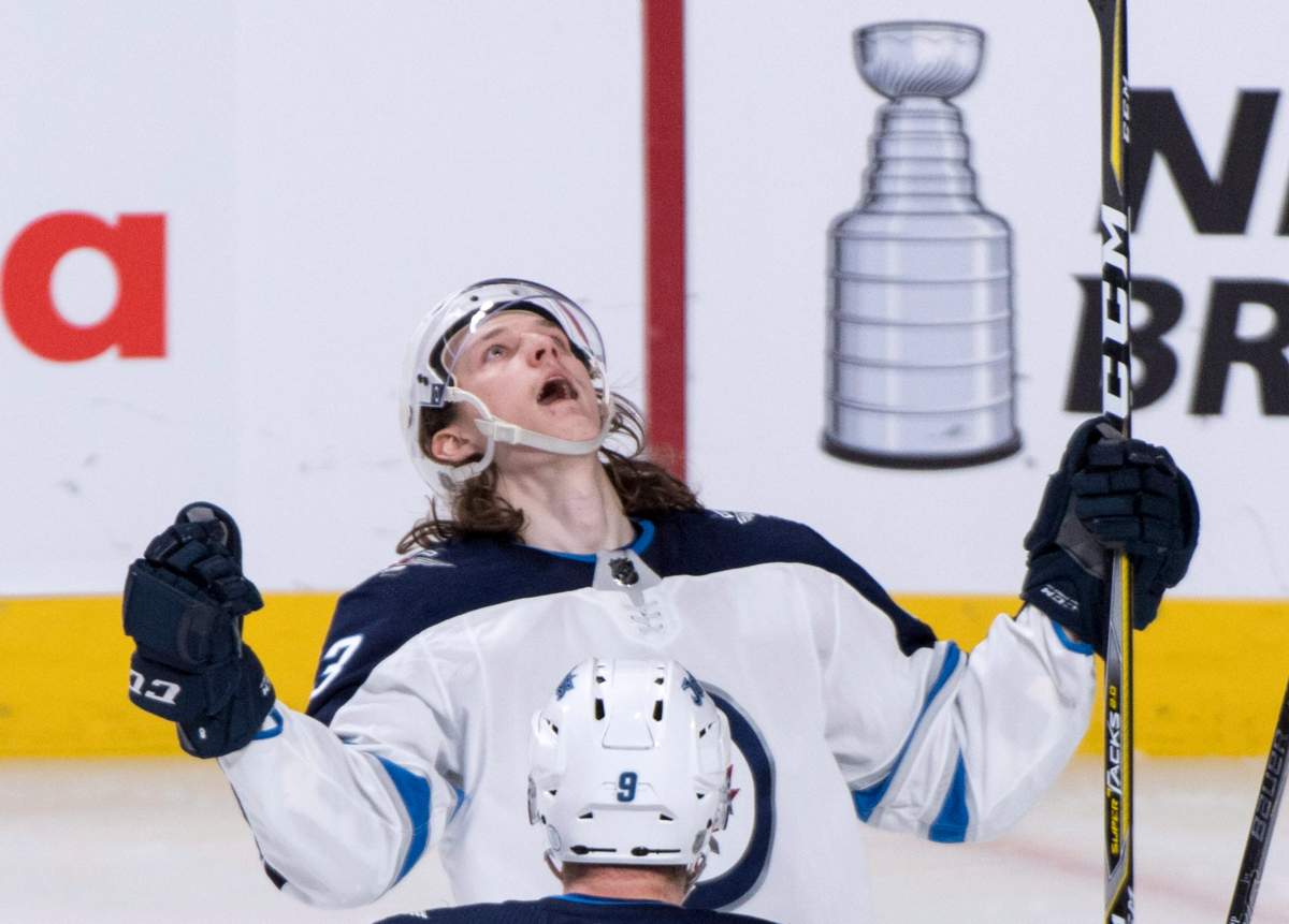 Winnipeg Jets' Sami Niku celebrates his goal past Montreal Canadiens goaltender Carey Price during third period NHL hockey action Tuesday, April 3, 2018 in Montreal.