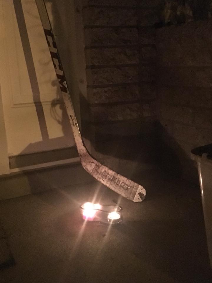 Christopher Scott put out his hockey stick to honour the Broncos hockey team.