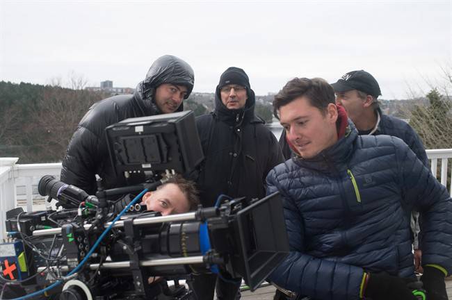 FILE - Halifax-based camera operator Andrew Stretch, right in blue jacket, and other crew on the set of Haven, a supernatural drama filmed in Nova Scotia.