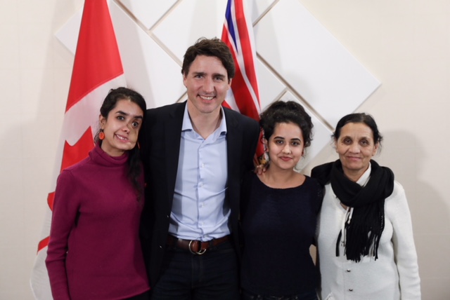 Shakila Zareen, left, meets with Prime Minister Justin Trudeau in Vancouver on April 5, 2018. At right, Shakila’s mother Sherman Jan Zareen and her sister Semira Sediqi.