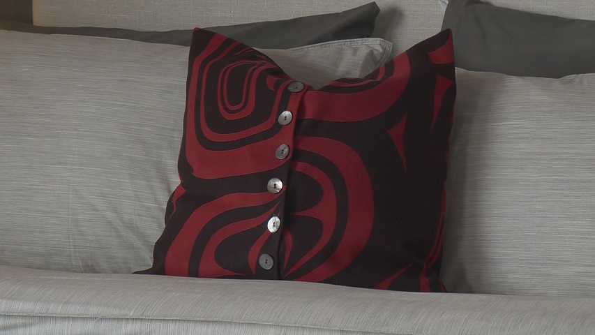 A pillow with a First Nation design.