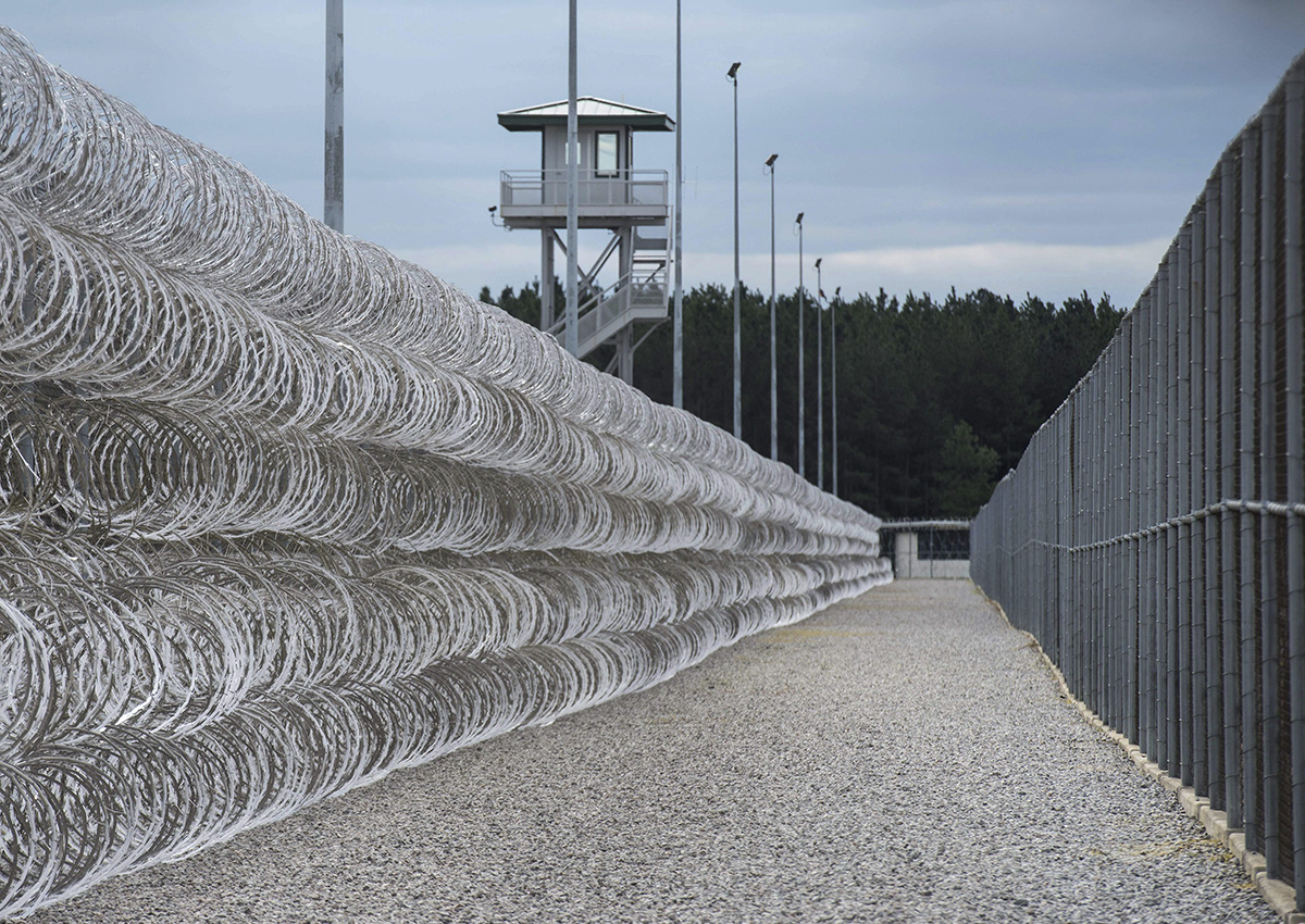 In this Feb. 9, 2016, file photo, razor wire protects a perimeter of the Lee Correctional Institution in Bishopville, S.C.