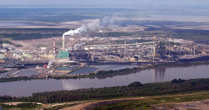 The Suncor mine facility along the Athabasca river as seen from a helicopter.