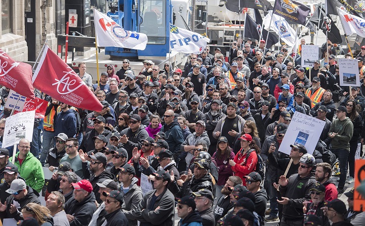 Crane operators participate in a demonstration in Montreal, Saturday, May 5, 2018. Graham Hughes/The Canadian Press.