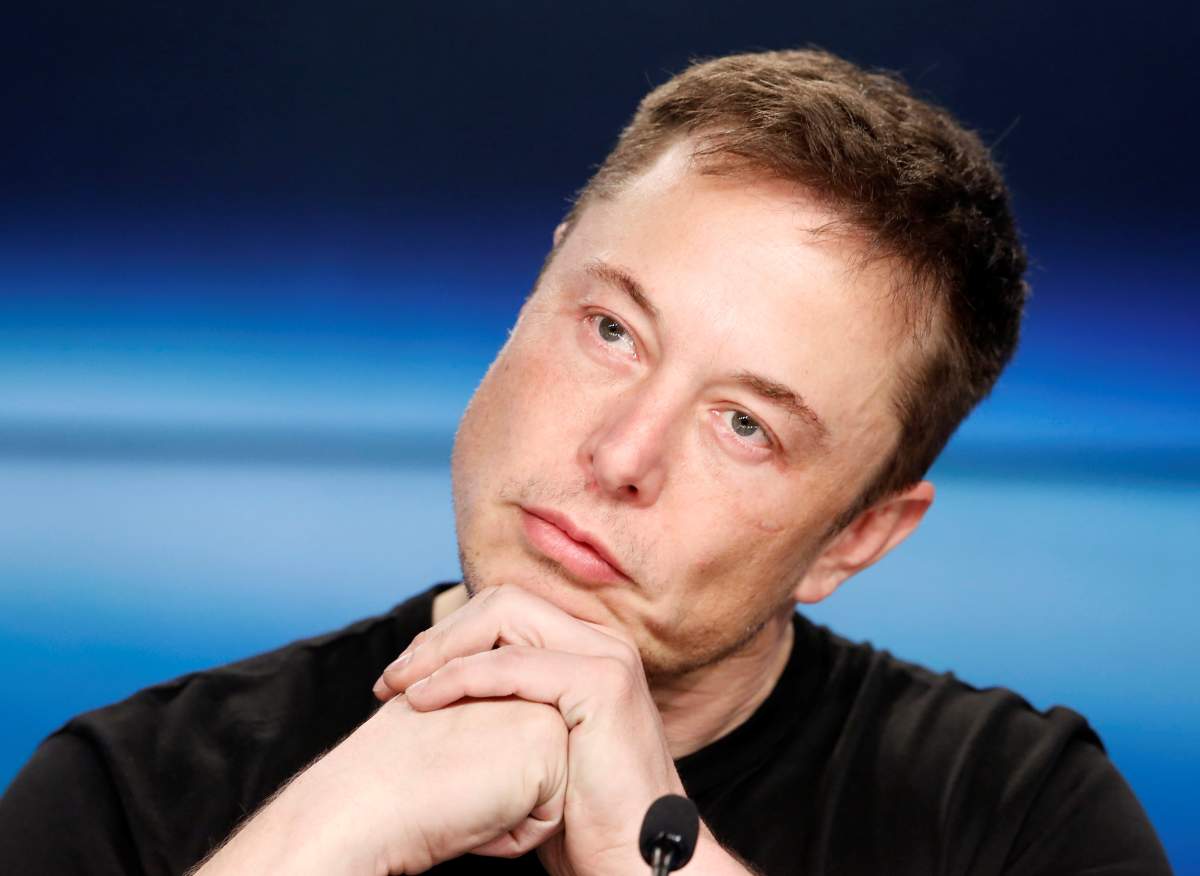 Elon Musk listens at a press conference following the first launch of a SpaceX Falcon Heavy rocket at the Kennedy Space Center in Cape Canaveral, Florida, U.S., February 6, 2018.