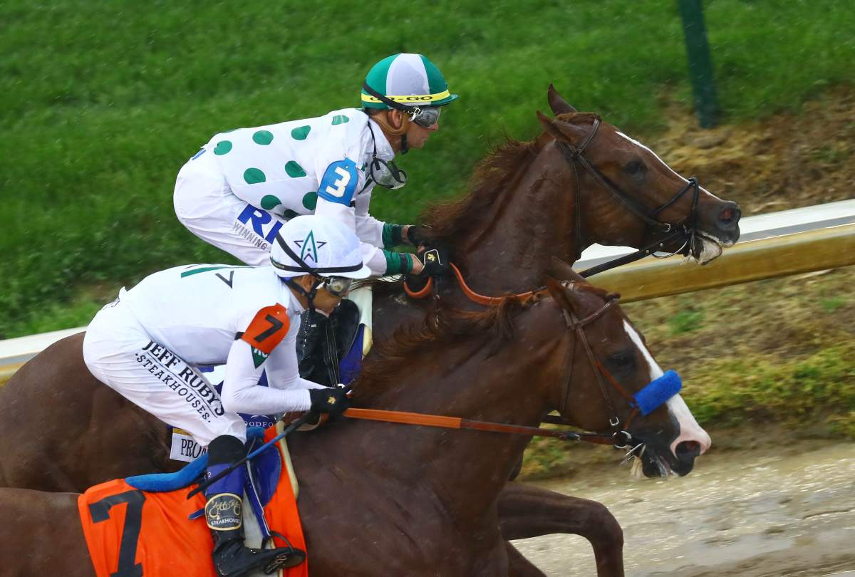 May 5, 2018; Louisville, KY, USA; Mike Smith aboard Justify (7) races Corey J. Lanerie aboard Promises Fulfilled (3) during the 144th running of the Kentucky Derby at Churchill Downs. 