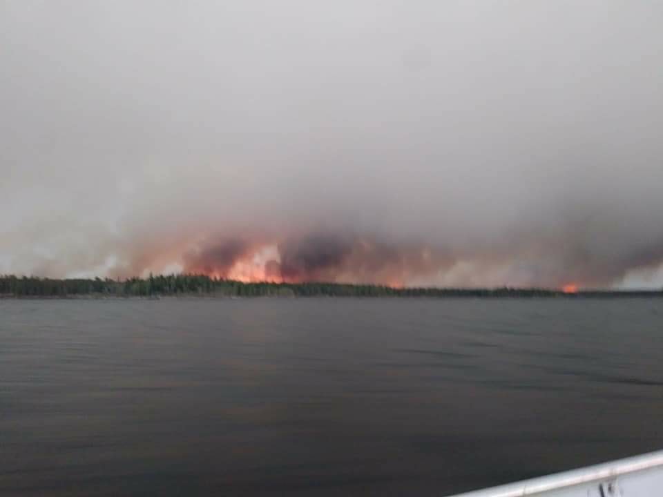 A wildfire burns in Little Grand Rapids. The Canadian Red Cross said more than 2,500 evacuees who were forced out due to wildfires over the last six weeks will be home once residents of Marcel Colomb First Nation are settled.