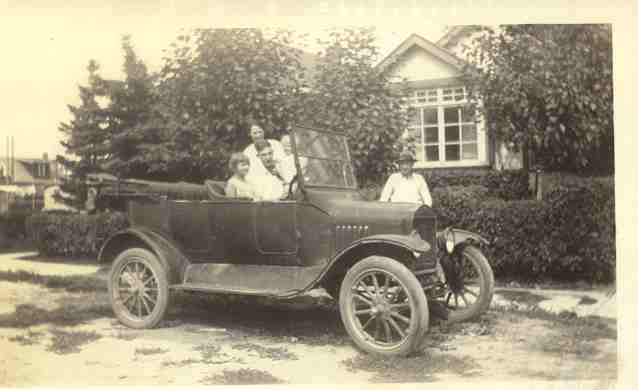 The Cook family in front of their home at 524 8 Avenue N.E.