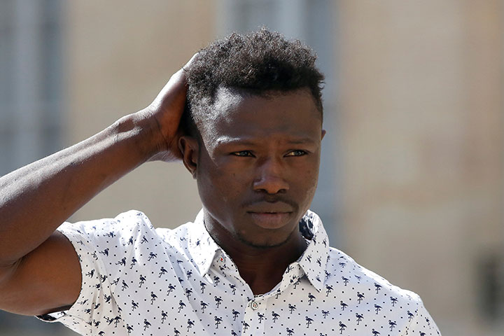 Mamoudou Gassama, 22, from Mali, leaves the Elysee Palace after his meeting with French President Emmanuel Macron, in Paris, May 28, 2018.