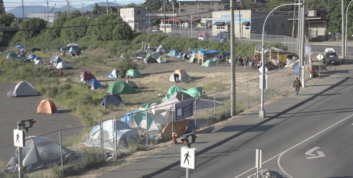 Campers who set up tents on
city-owned land across from a shopping mall in downtown Nanaimo were
served with eviction notices Friday.