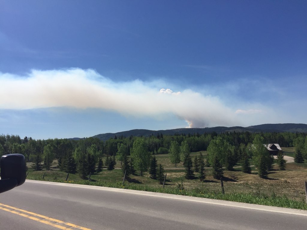 Large plumes of smoke could be seen from a distance as firefighters battle a wildfire near Bragg Creek.