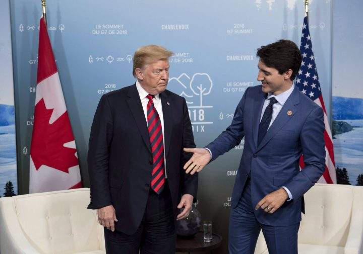 Prime Minister Justin Trudeau shakes hands with U.S. President Donald Trump during a meeting at the G7 leaders summit in La Malbaie, Quebec, June 8, 2018.