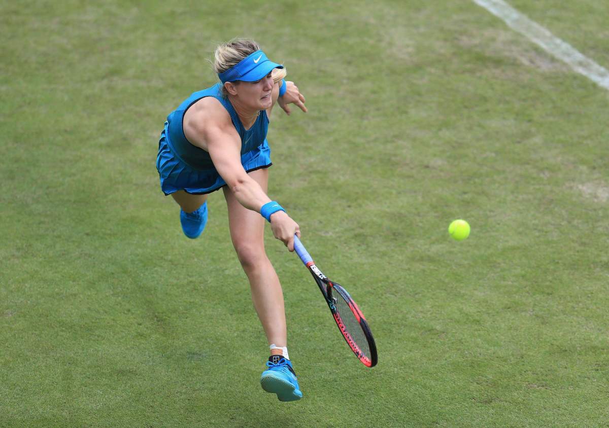 Canada's Eugenie Bouchard plays a shot in her first round tennis match with Jennifer Brady during day one of the Nature Valley Classic at Edgbaston Priory, Birmingham, England, Monday June 18, 2018.