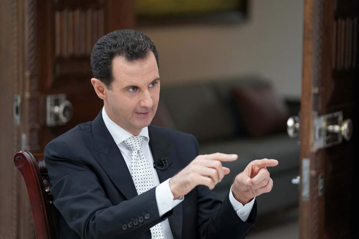 Syria's President Bashar al Assad gestures during an interview with a Greek newspaper in Damascus, Syria in this handout released May 10, 2018. 