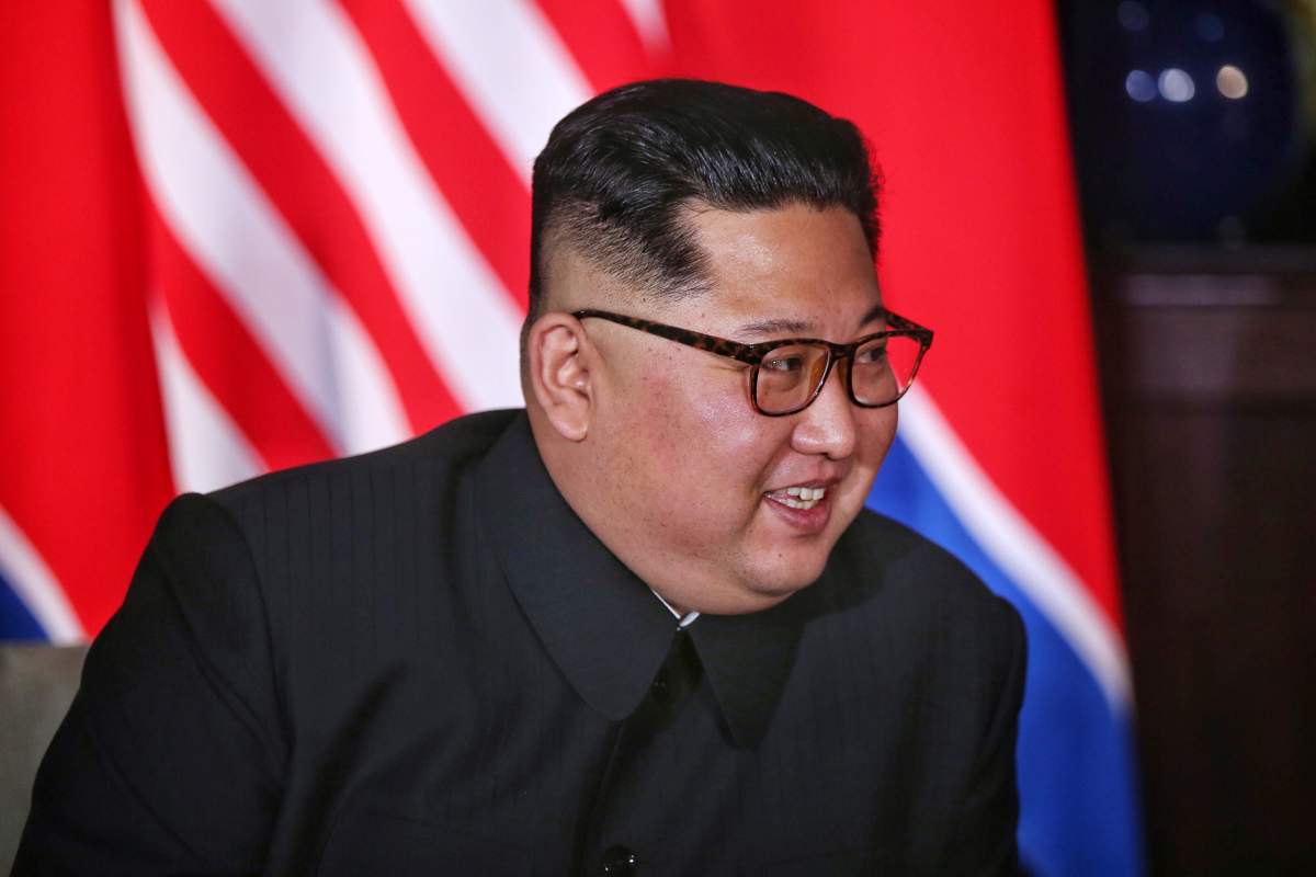 North Korean leader Kim Jong Un smiles next to U.S. President Donald Trump (not pictured) at the Capella Hotel on Sentosa island in Singapore June 12, 2018.
