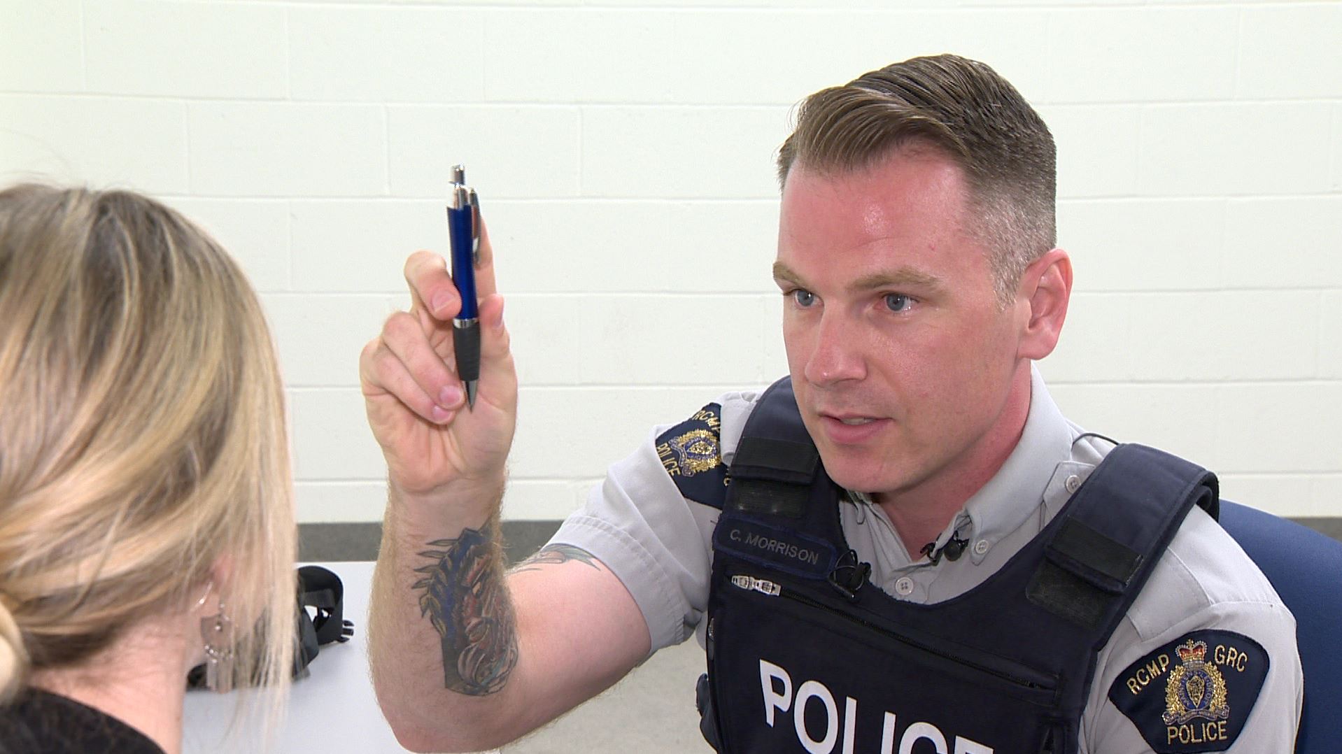 RCMP Const. Chad Morrison performs a test on Alex Noonan, a junior communications officer for the police, as part of a staged drug recognition evaluation for journalists in Dartmouth, N.S., on June 29, 2018.