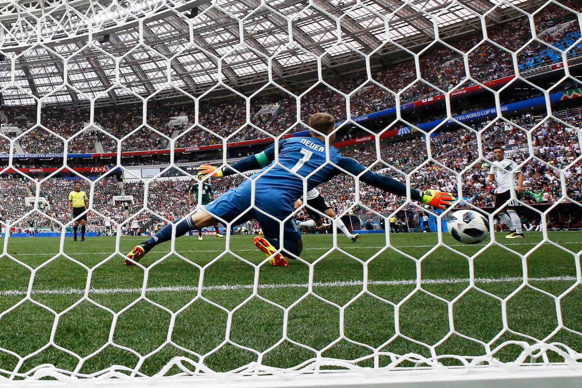 Manuel Neuer of Germany is beaten as Mexico go 1-0 up during the FIFA World Cup 2018 group F preliminary round soccer match between Germany and Mexico in Moscow.