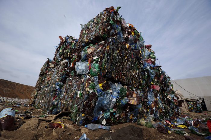 In this March 12, 2015 file photo, plastic trash is compacted into bales ready for further processing at the waste processing dump on the outskirts of Minsk, Belarus.