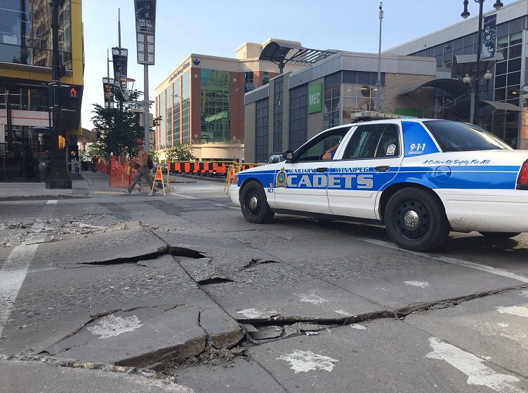 A section of Portage Avenue at Donald Street closed Wednesday after the pavement buckled.
