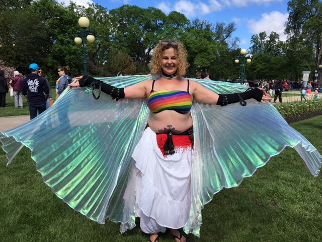 Holly Peterson shows off her costume prior to the parade beginning on Sunday.