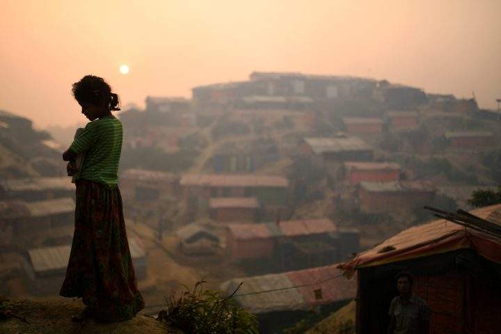 A Rohingya refugee is seen in Balukhali refugee camp at dawn near Cox's Bazaar, Bangladesh, March 28, 2018. 