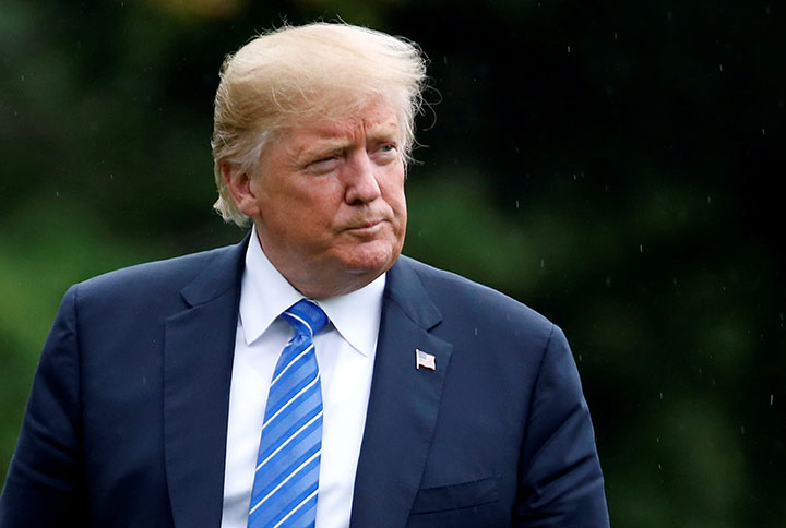 U.S. President Donald Trump walks from Marine One as he returns from Kansas City, Missouri, to the White House in Washington, July 24, 2018.