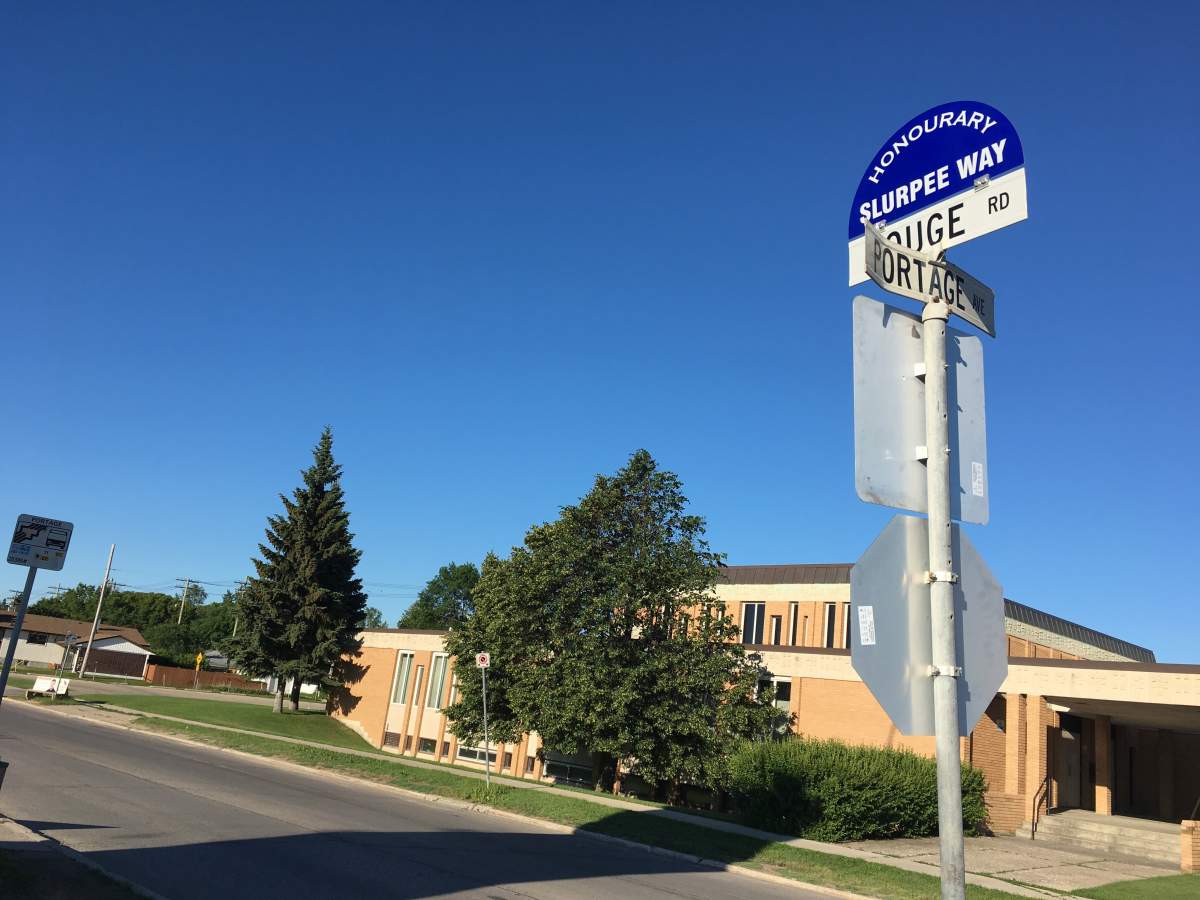 There is a new street sign at the corner of Portage and Rouge.