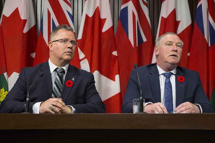 President of the Police Association of Ontario Bruce Chapman (right) and President of the Ontario Provincial Police Association Rob Jamieson attend a news conference at the Queens Park Legislature in Toronto on Thursday Nov. 2, 2017. 