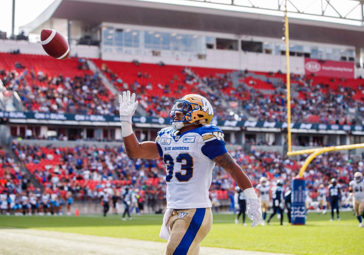 Winnipeg Blue Bombers' Andrew Harris celebrates his touchdown during first half CFL football action against the Toronto Argonauts, in Toronto on Saturday, July 21, 2018. THE CANADIAN PRESS/Mark Blinch.