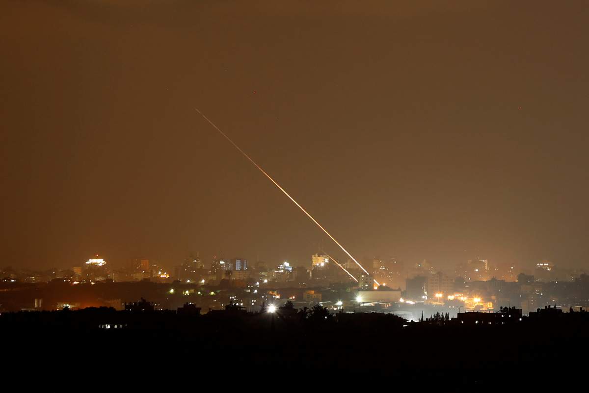 Streaks of light are pictured as rockets are launched from the northern Gaza Strip towards Israel, as seen from Sderot, Israel August 8, 2018.