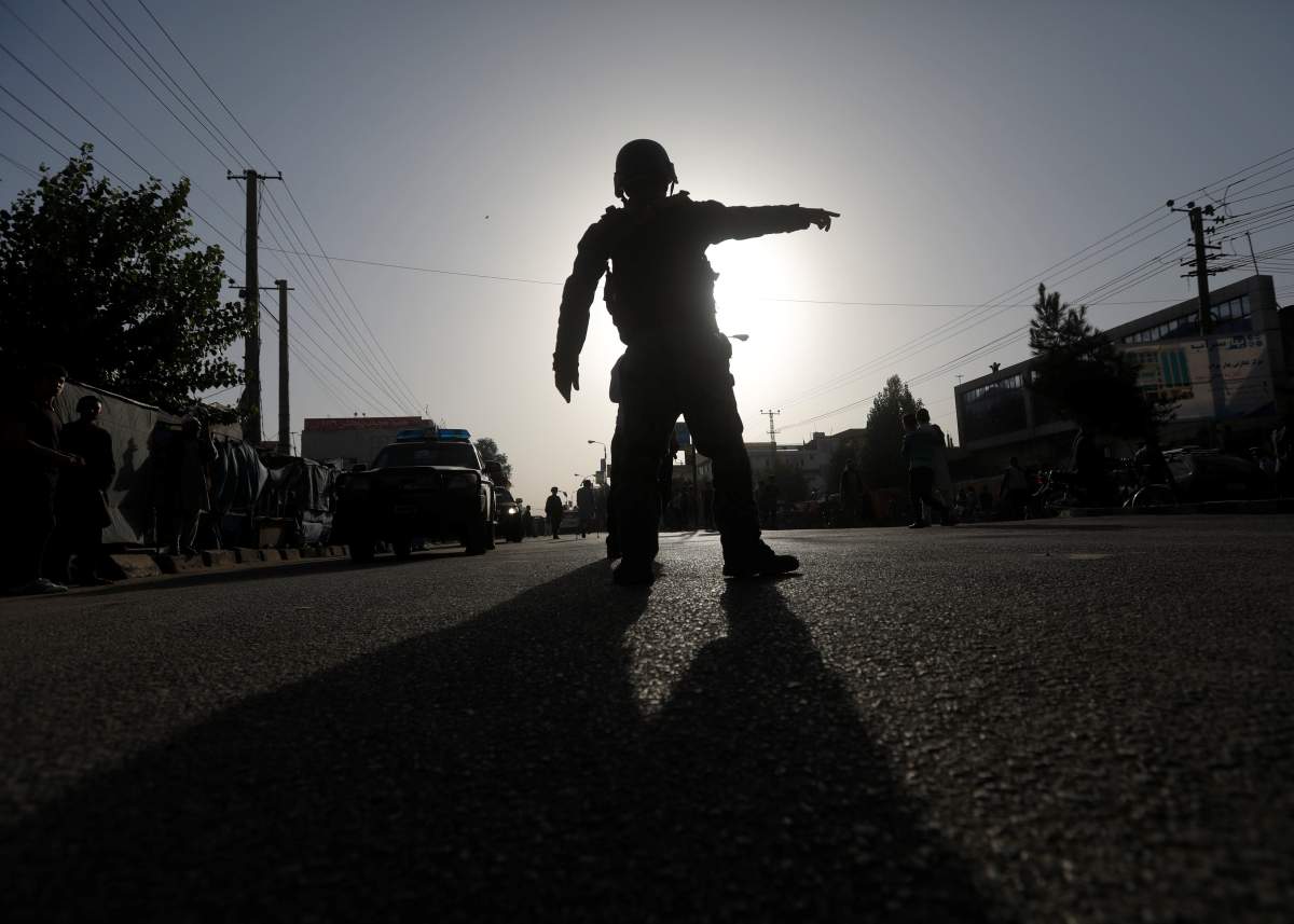 Afghan policemen arrive at the site of a suicide bomb attack in Kabul, Afghanistan August 15, 2018.