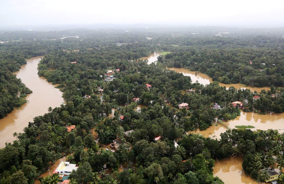 An aerial view shows partially submerged houses at a flooded area in the southern state of Kerala, India, August 17, 2018.