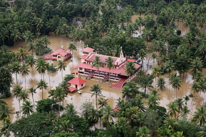 An aerial view shows partially submerged houses and church at a flooded area in the southern state of Kerala, India, August 17, 2018.