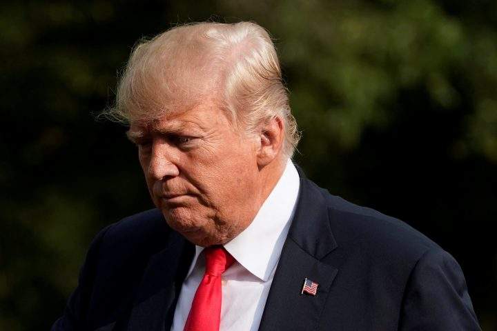 U.S. President Donald Trump walks on the South Lawn of the White House upon his return from Bedminster, New Jersey, to Washington, U.S., Aug. 19, 2018.