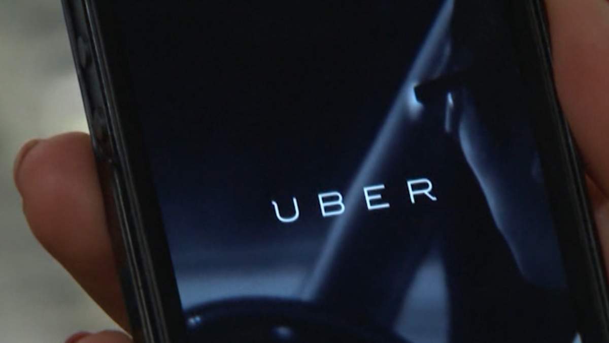 A person orders an Uber on the app.