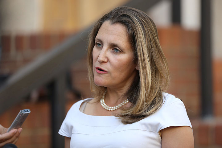 FILE - Foreign Minister Chrystia Freeland speaks to journalists outside the U.S. Trade Representative's office in Washington, August 28, 2018.
