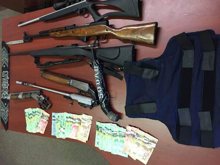 Police say 54 criminal code charges have been laid after two separate searches in Prince Albert, Sask.