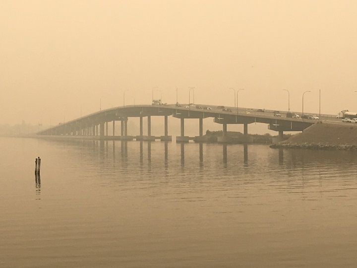Heavy wildfire smoke surrounds the William R. Bennett Bridge connecting Kelowna to West Kelowna on Saturday, August 18, 2018.