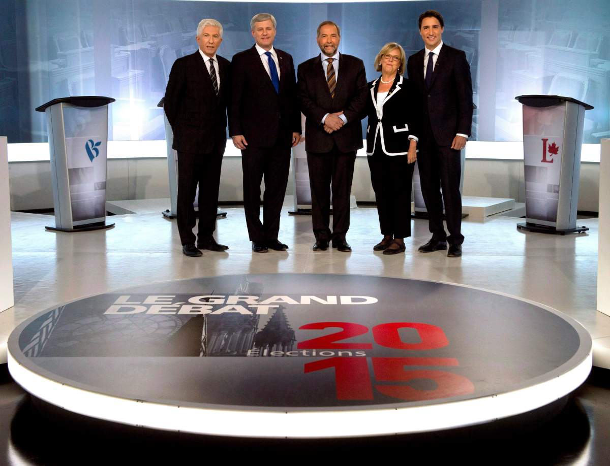 In this Sept. 24, 2015 file photo, Bloc Quebecois Leader Gilles Duceppe, from left to right, Conservative Leader Stephen Harper, NDP Leader Tom Mulcair, Green Party Leader Elizabeth May and Liberal Leader Justin Trudeau pose for photos before the French-language leaders' debate in Montreal.