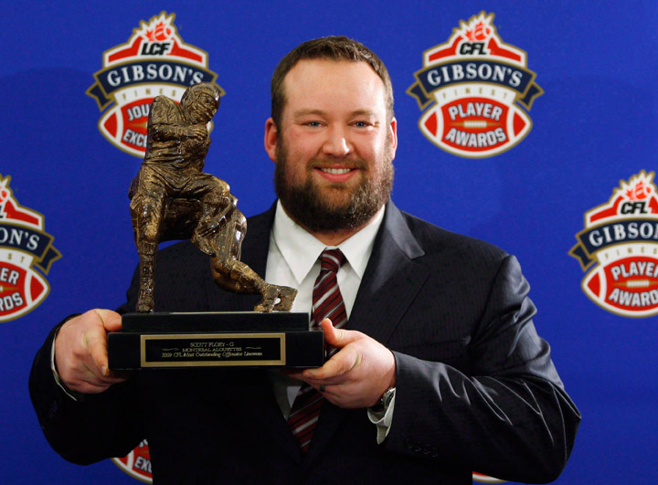 Scott Flory, of the Montreal Alouettes, holds his trophy for the CFL Most Outstanding Lineman during the 2009 Gibson's Finest Players Awards in Calgary on November 26, 2009. Punter Hank Ilesic, stalwart offensive lineman Scott Flory, late centre/linebacker Tom Hugo, defensive lineman Brent Johnson and defensive back Barron Miles will be inducted as players in the Canadian Football Hall of Fame. 