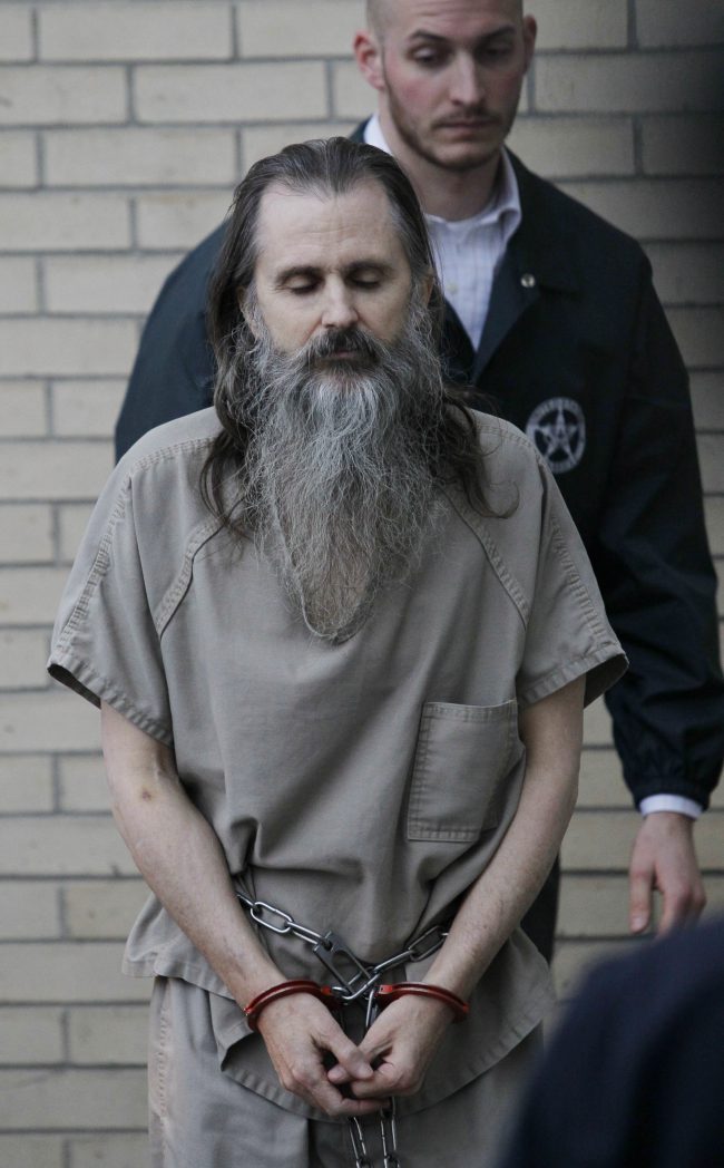 FILE – In this Dec. 10 2010, file photo, Brian David Mitchell is escorted by a U.S. Marshall as he arrives at the federal courthouse in Salt Lake City.