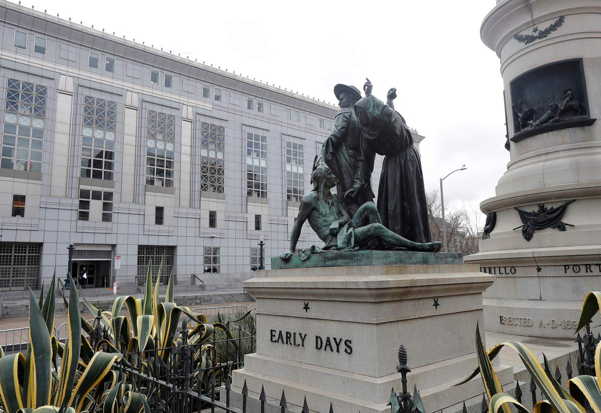 FILE - This March 2, 2018 file photo shows a statue that depicts a Native American at the feet of a Spanish cowboy and Catholic missionary in San Francisco.